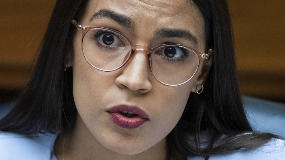 Alexandria Ocasio-Cortez speaking in glasses