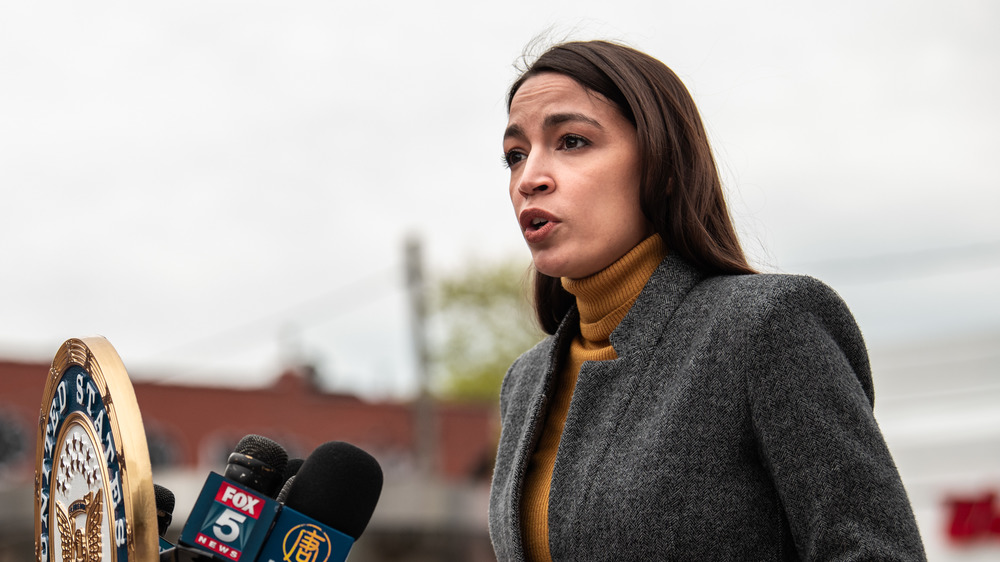 Alexandria Ocasio-Cortez speaking at a campaign rally