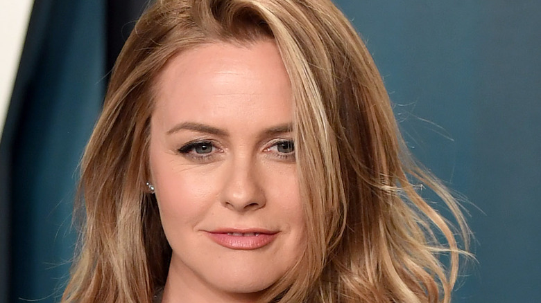 Alicia Silverstone wears her hair down