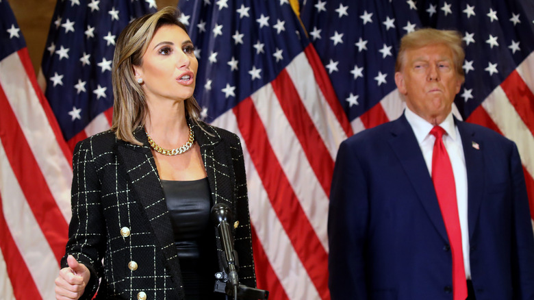 Alina Habba speaking while Donald Trump watches her