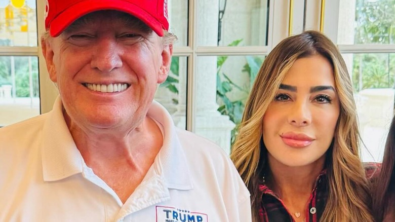 Donald Trump and Siggy Flicker smile side by side