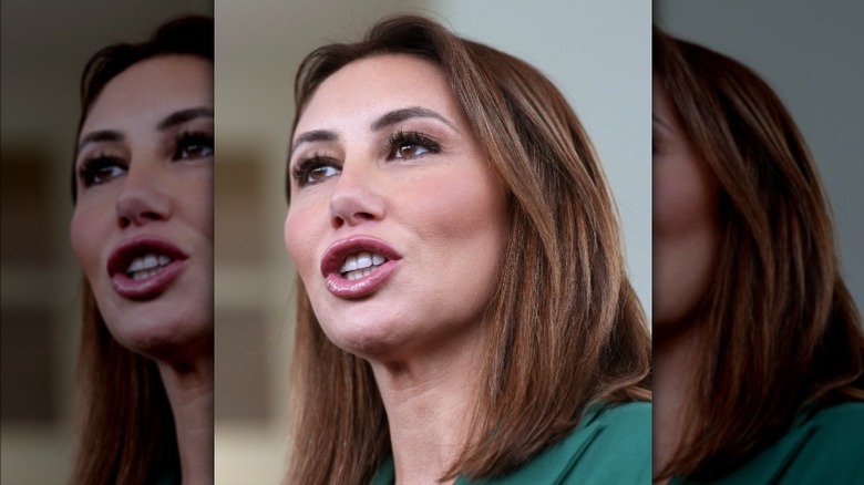 Close-up of Alina Habba speaking while wearing an emerald green jacket