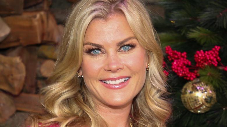Alison Sweeney with a Christmassy background