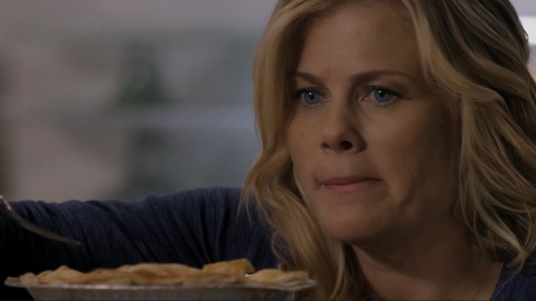 Alison Sweeney looking confused in front of a pie