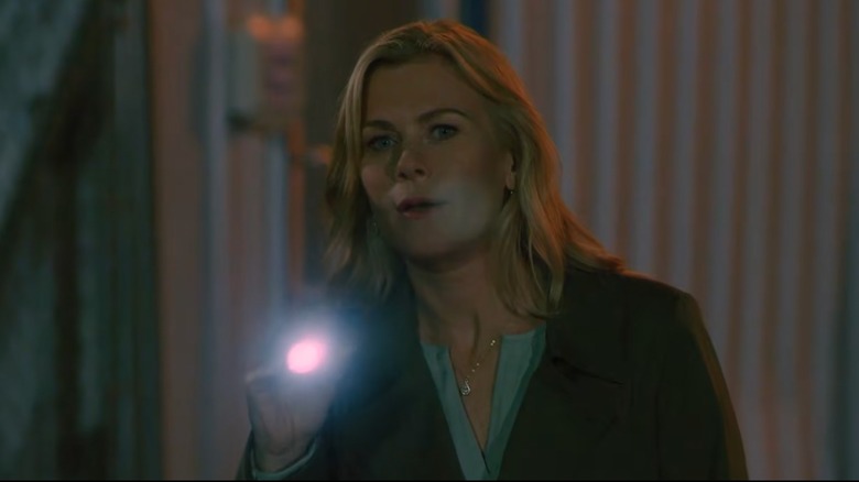 Alison Sweeney looking with a flashlight