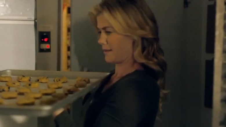 Alison Sweeney carrying a tray of chocolate chip cookies