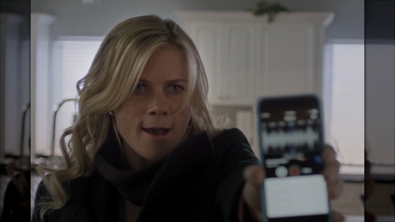 Alison Sweeney holding a phone to the camera