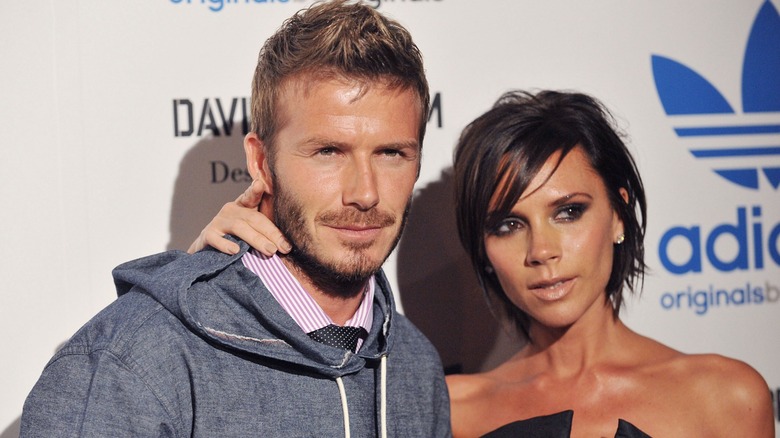 David and Victoria Beckham posing at event