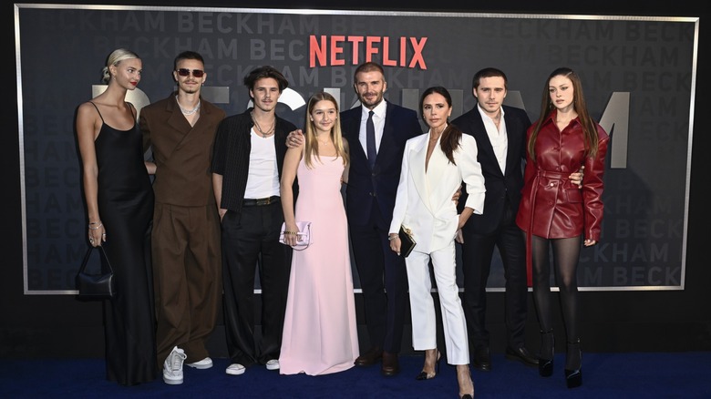 The Beckham family posing at event