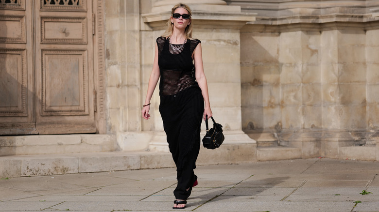 Woman walking in all black outfit