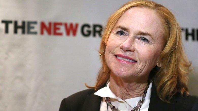 Amy Madigan in a collared shirt and blazer