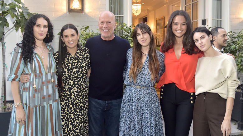 Emma Willis and Bruce Willis posing with Demi Moore and their daughters