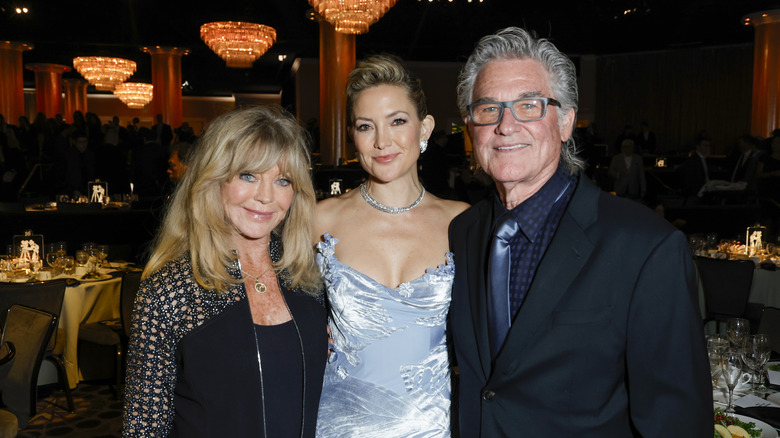 Kate Hudson posing with Kurt Russell and Goldie Hawn