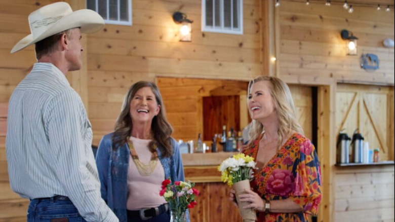 Alison Sweeney (right, in orange flower dress) in "Romance at Hope Ranch"