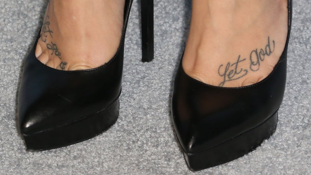 Demi Lovati's feet showing her tattoos