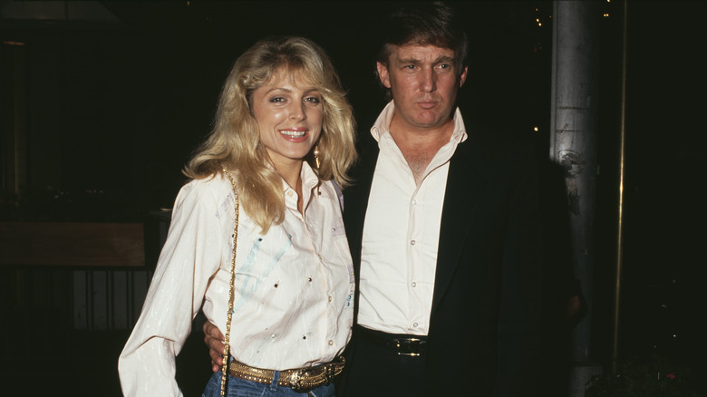 Donald Trump and Marla Maples posing for a photograph