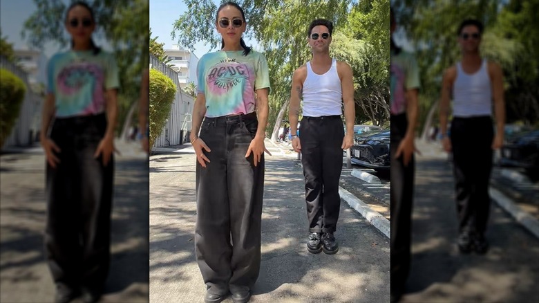 Janel Parrish and Sasha Farber standing in a street.