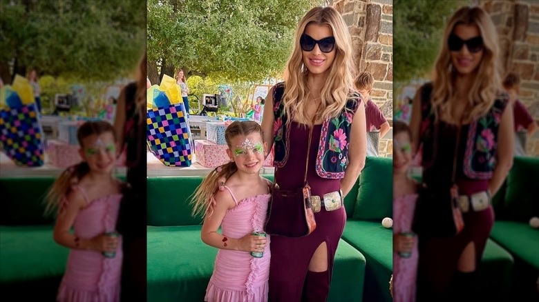 Jessica Simpson posing with her arm around her daughter Birdie Mae.