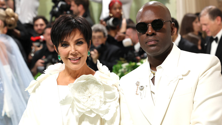 Kris Jenner and Corey Gamble wearing white