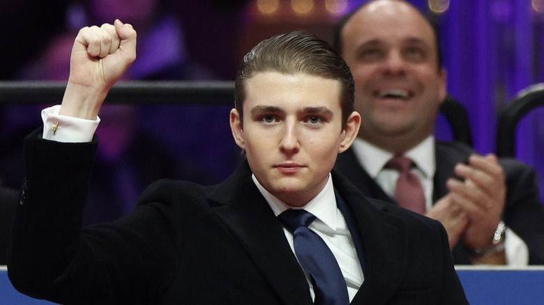 Barron Trump with his fist raised.