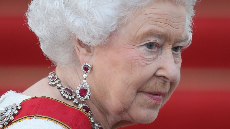 Queen Elizabeth looking over her shoulder