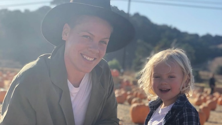 Pink sitting in the sun with her son Jameson
