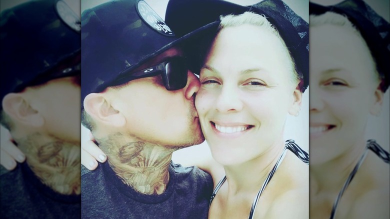 Selfie of Carey Hart kissing Pink on the cheek