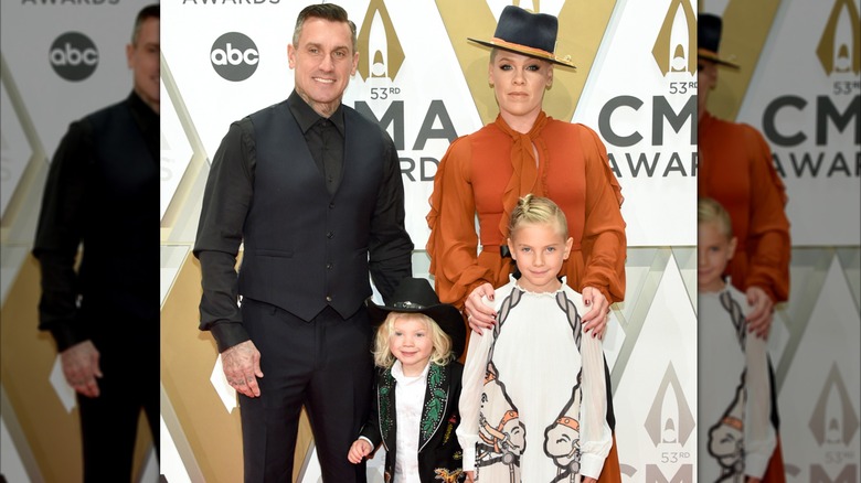 Pink and Carey Hart posing with their children in 2019