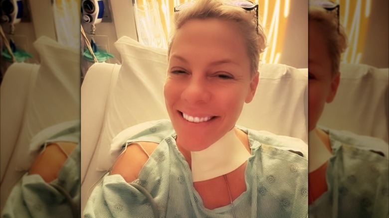 Pink with a bandaged neck in hospital
