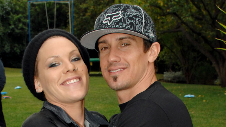 Pink wearing a beanie and Carey Hart wearing a cap in 2007 outdoors
