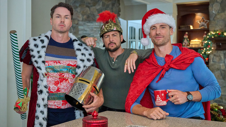 Paul Campbell, Tyler Hynes, and Andrew Walker wearing costume accessories