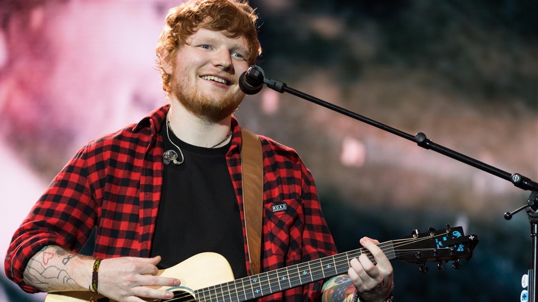 Ed Sheeran playing guitar and singing