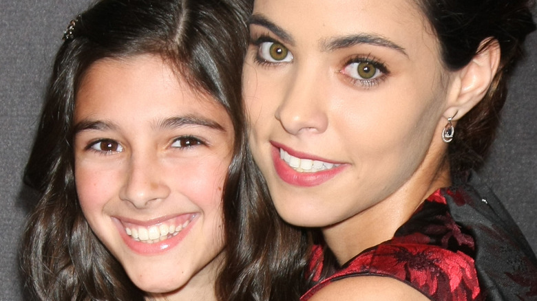 DOOL stars Lauren Boles and Vivian Jovanni hug.