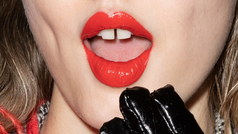 close-up of woman's lips with red lipstick