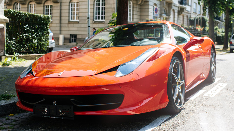 Red ferrari in city