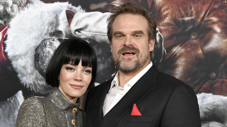 David Harbour and Lily Allen posing for photos in their finery