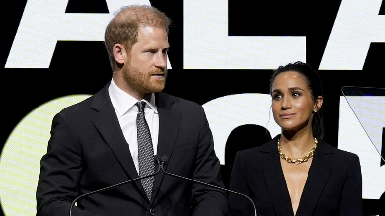 Prince Harry and Meghan Markle speaking onstage