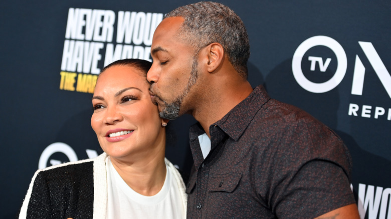 Mike Jackson kisses the side of Egypt Sherrod's face