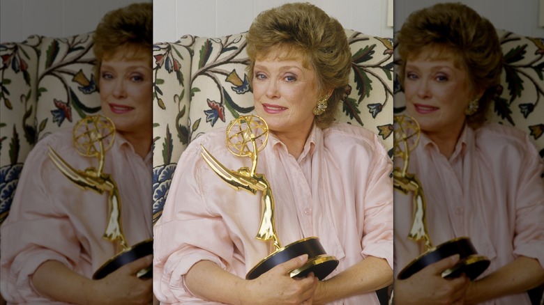 Rue McClanahan holding an award she won for Golden Girls