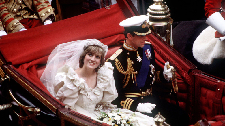 Princess Diana and Prince Charles inside the royal carriage on their wedding day.