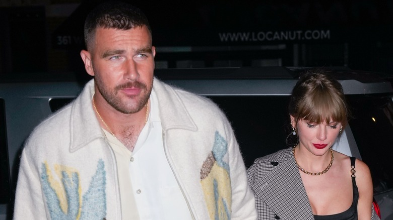 Travis Kelce and Taylor Swift walking