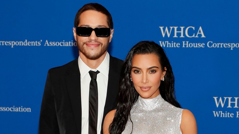 Kim Kardashian and Pete Davidson smiling. 