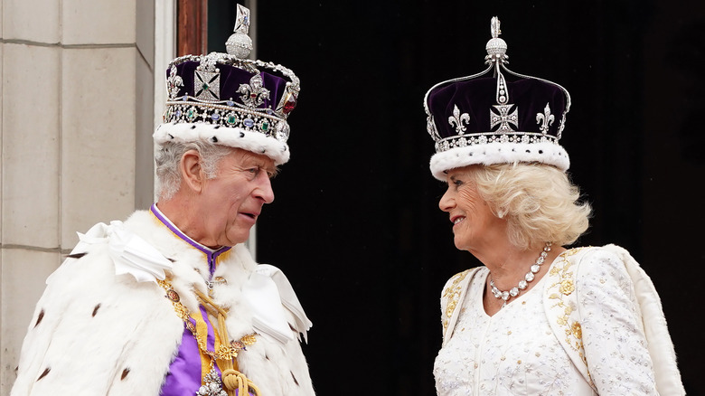 King Charles and Queen Camilla wearing crowns