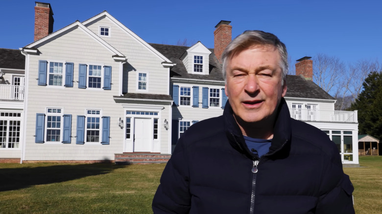 Alec Baldwin stands outside his home in Amagansett, New York in January 2024