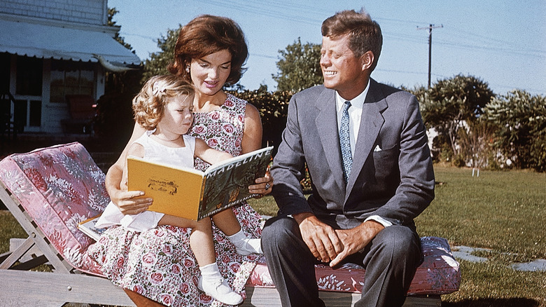 Jackie Kennedy and JFK read to Caroline Kennedy at Hyannis Port