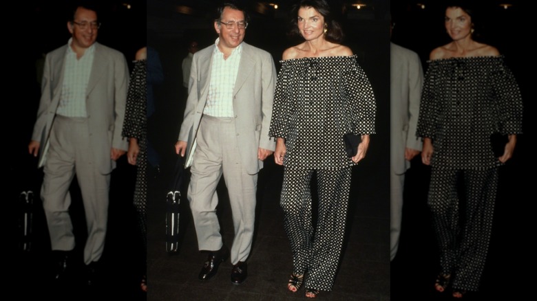 Jackie Kennedy Onassis walking into an event with a man
