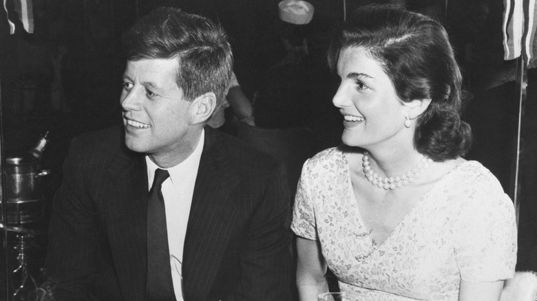 JFK and Jackie Kennedy sitting at a table at the Stork Club in NY