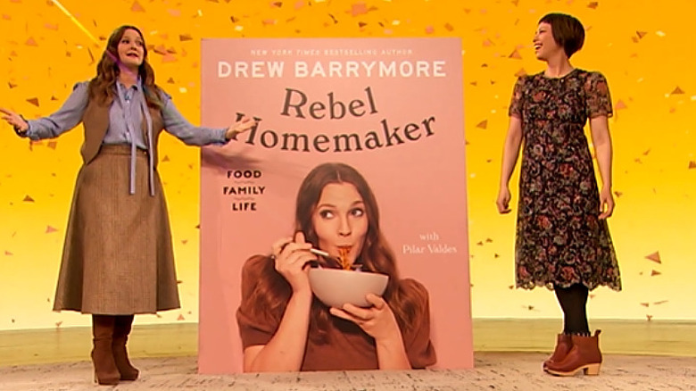 Drew Barrymore and Pilar Valdes showing the cover of their cookbook on The Drew Barrymore Show