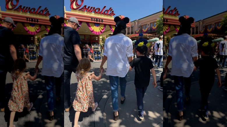 Prince Harry and Meghan Markle walking hand in hand with Princess Lilibet and Prince Archie
