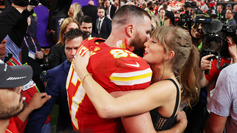 Taylor Swift hugging Travis Kelce after winning the Super Bowl